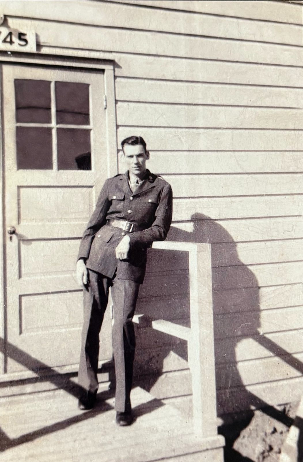 George in his Class-A service uniform outside barracks '45' at Camp Carson.