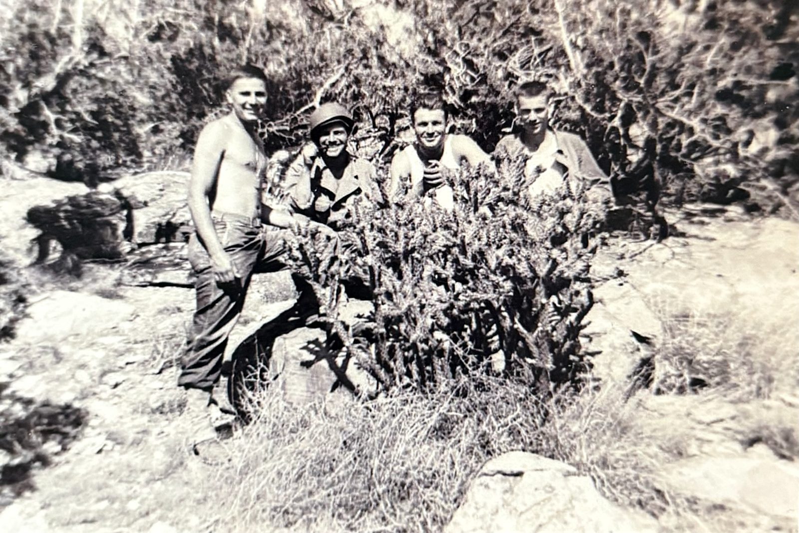 George (far right) and three others among cholla cactus — warm-weather training in the semi-desert.